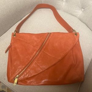 Extra super soft Kooba leather bag in lovely rusty orange to add a pop of color.